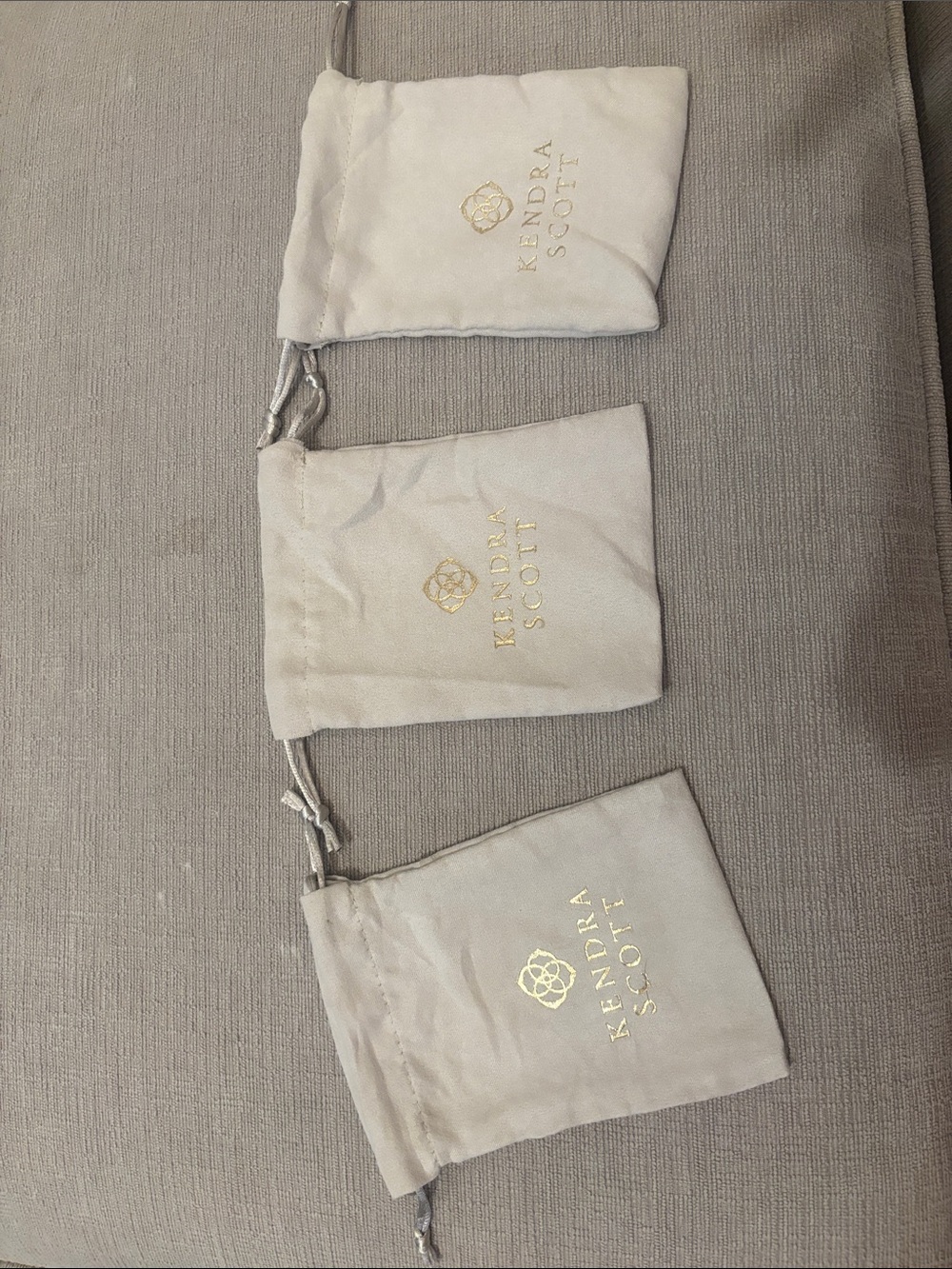 Kendra Scott Cream Drawstring Jewelry Pouches with Gold Logo (Set of 3)